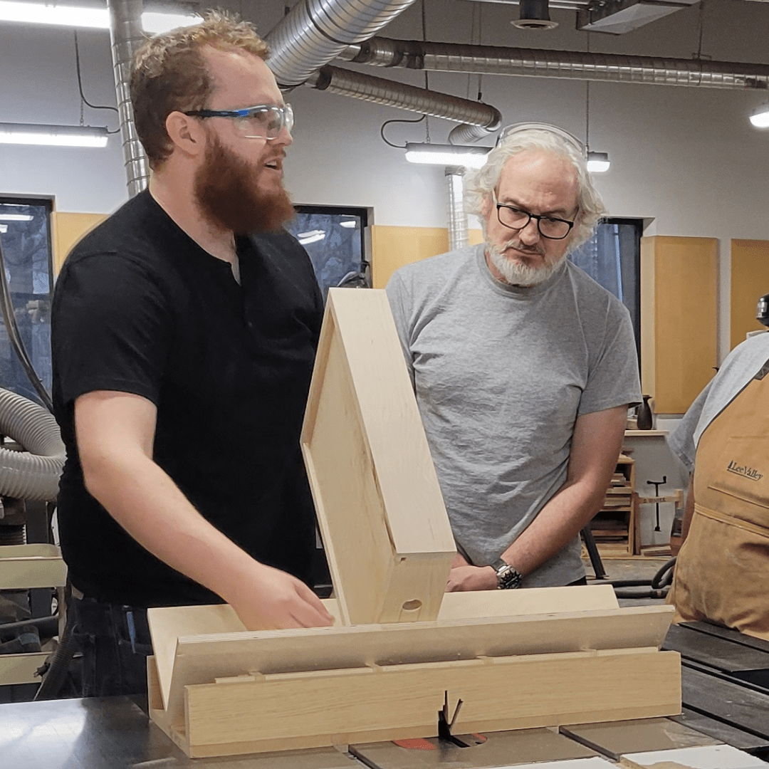 Tyler Poplar teaching a class at the saw with students