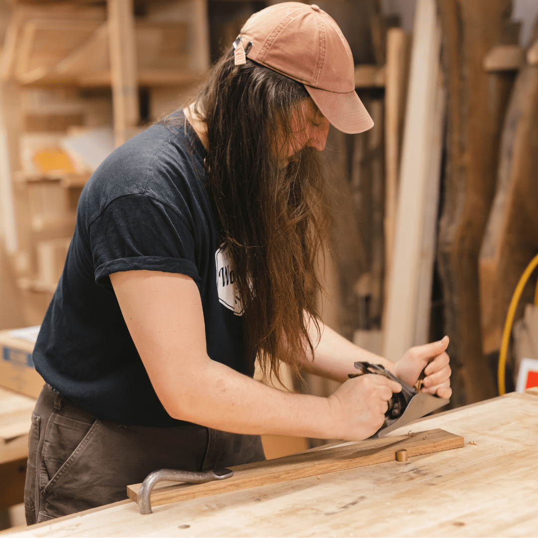 Devon Curtis at work in the woodshop